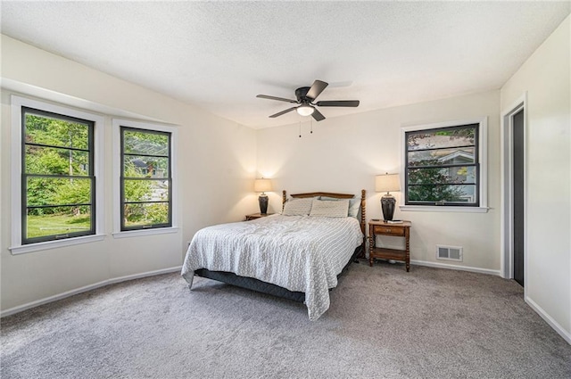 12419 Askew Dr, Grandview, MO 64030 - carpeted bedroom with ceiling fan and a textured ceiling