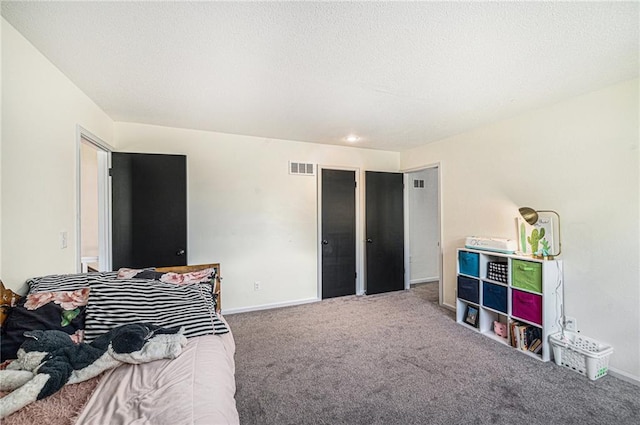 12419 Askew Dr, Grandview, MO 64030 - carpeted bedroom with baseboards and a textured ceiling