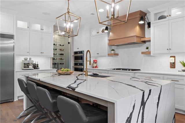 23717 W 118th Ter, Olathe, KS 66061 - kitchen with appliances with stainless steel finishes, a chandelier, open shelves, custom exhaust hood, and decorative backsplash