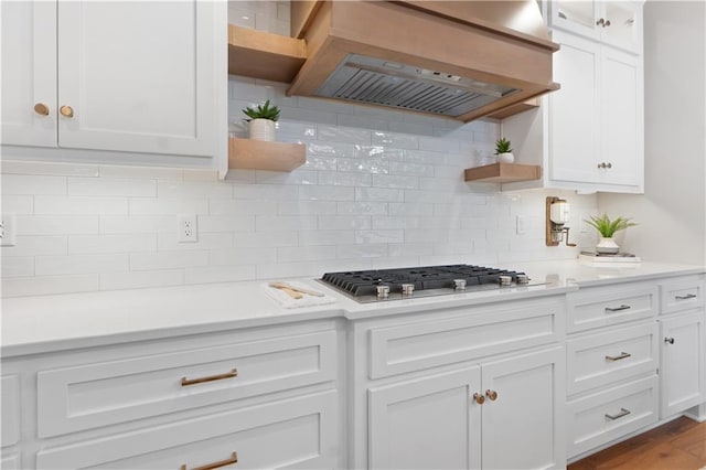 23717 W 118th Ter, Olathe, KS 66061 - kitchen with open shelves, custom exhaust hood, stainless steel gas cooktop, white cabinets, and light countertops