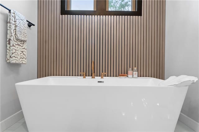23717 W 118th Ter, Olathe, KS 66061 - full bathroom featuring a freestanding bath and baseboards