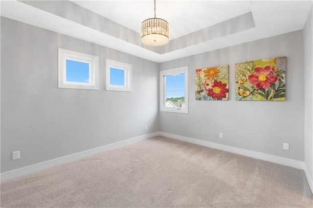 23717 W 118th Ter, Olathe, KS 66061 - spare room featuring carpet flooring and a chandelier