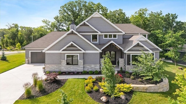 23717 W 118th Ter, Olathe, KS 66061 - craftsman-style house featuring stone siding, driveway, stucco siding, and a front yard