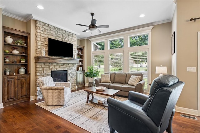 1415 SW Antiquity Dr, Lees Summit, MO 64081 - living room featuring a ceiling fan, crown molding, a stone fireplace, wood finished floors, and recessed lighting