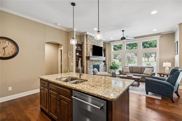1415 SW Antiquity Dr, Lees Summit, MO 64081 - kitchen featuring stainless steel dishwasher, ceiling fan, arched walkways, open floor plan, and a stone fireplace