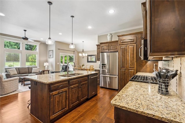1415 SW Antiquity Dr, Lees Summit, MO 64081 - kitchen with appliances with stainless steel finishes, ceiling fan, a kitchen island with sink, recessed lighting, and dark brown cabinets