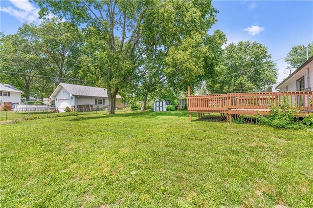 600 W Powahatan Ct, Independence, MO 64056 - view of yard featuring a shed, a deck, and a detached garage
