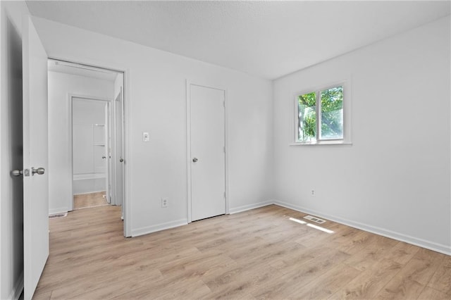 600 W Powahatan Ct, Independence, MO 64056 - unfurnished bedroom featuring light wood-type flooring and baseboards