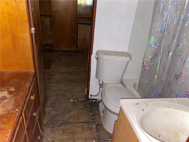 39055 Railroad Ave, Osawatomie, KS 66064 - full bathroom with wood finished floors and vanity