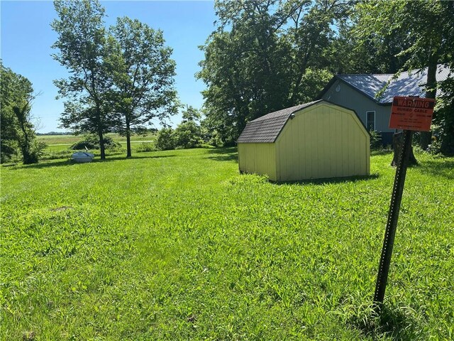 39055 Railroad Ave, Osawatomie, KS 66064 - view of grassy yard featuring a storage unit