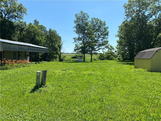 39055 Railroad Ave, Osawatomie, KS 66064 - view of grassy yard with a shed
