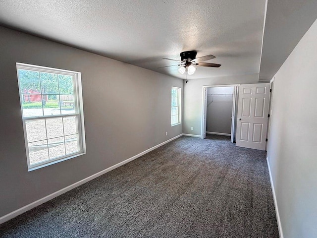 622 Morgan Dr, Stockton, MO 65785 - carpeted empty room with a textured ceiling, plenty of natural light, and ceiling fan