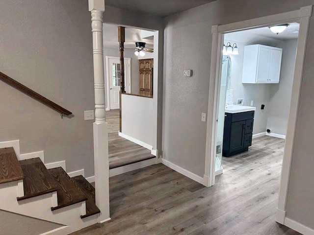 622 Morgan Dr, Stockton, MO 65785 - staircase with wood finished floors and ceiling fan
