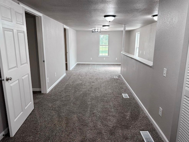 622 Morgan Dr, Stockton, MO 65785 - empty room featuring a textured ceiling and carpet floors