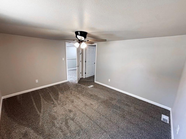 622 Morgan Dr, Stockton, MO 65785 - spare room featuring a ceiling fan, dark colored carpet, and a textured ceiling