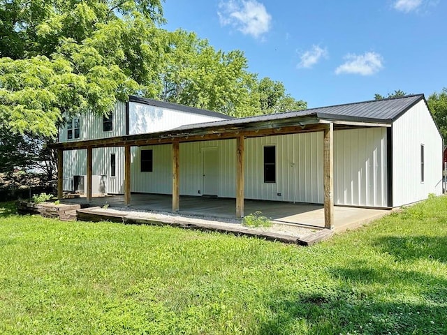 622 Morgan Dr, Stockton, MO 65785 - rear view of property featuring a lawn and a metal roof