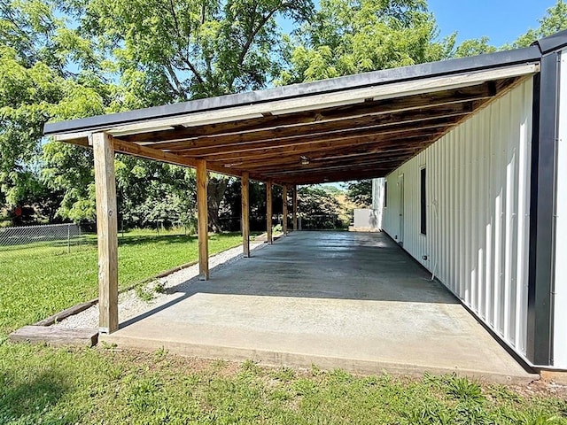 622 Morgan Dr, Stockton, MO 65785 - view of parking / parking lot featuring a carport
