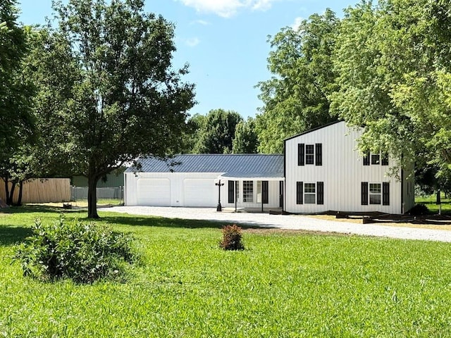 622 Morgan Dr, Stockton, MO 65785 - view of front of house with a garage and a metal roof