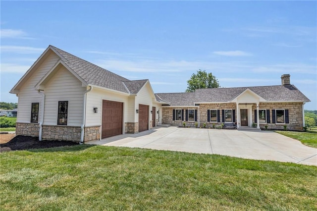 12811 W 71st St, Shawnee, KS 66216 - view of front of property featuring stone siding, a garage, and a front yard
