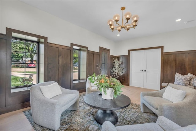 12811 W 71st St, Shawnee, KS 66216 - living area featuring a chandelier, light wood finished floors, and recessed lighting