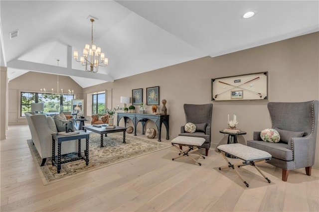 12811 W 71st St, Shawnee, KS 66216 - living area with a chandelier, healthy amount of natural light, wood finished floors, recessed lighting, and high vaulted ceiling