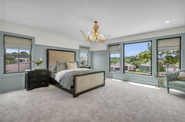 12811 W 71st St, Shawnee, KS 66216 - carpeted bedroom with multiple windows, a chandelier, and recessed lighting