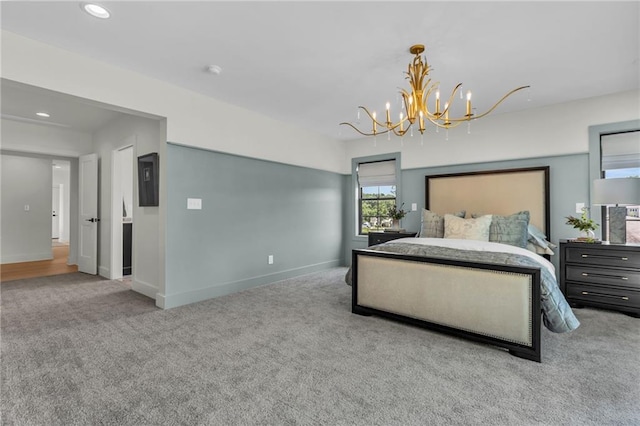 12811 W 71st St, Shawnee, KS 66216 - carpeted bedroom featuring a chandelier and recessed lighting