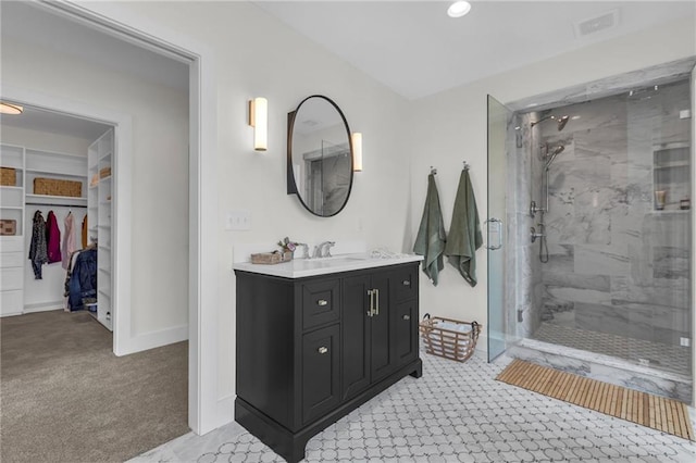 12811 W 71st St, Shawnee, KS 66216 - bathroom featuring a marble finish shower, vanity, and a walk in closet