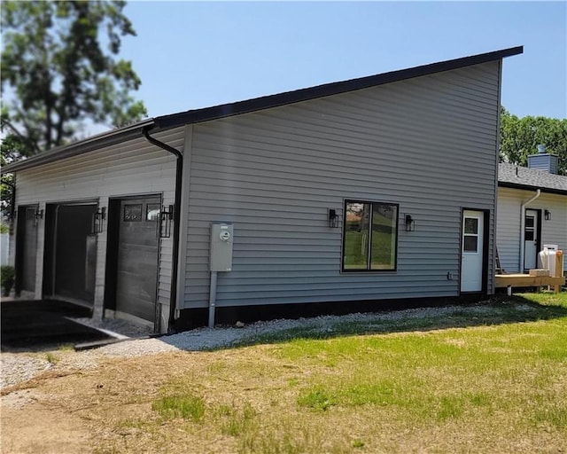 104 Lakeshore Dr, Kimberling City, MO 65686 - view of home's exterior featuring a garage and a yard