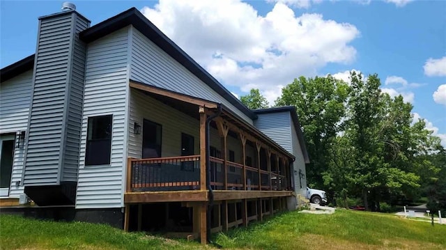 104 Lakeshore Dr, Kimberling City, MO 65686 - view of side of home featuring a chimney and a deck
