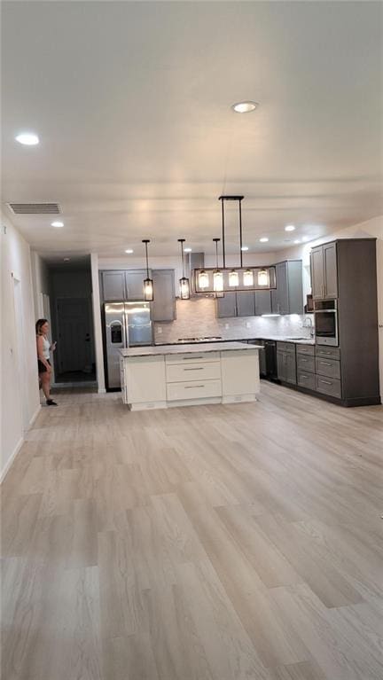 104 Lakeshore Dr, Kimberling City, MO 65686 - kitchen featuring stainless steel appliances, extractor fan, recessed lighting, a center island, and backsplash