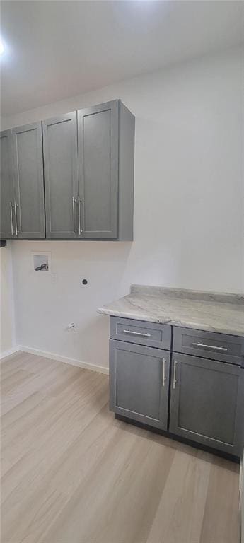 104 Lakeshore Dr, Kimberling City, MO 65686 - laundry area with cabinet space, washer hookup, and light wood-type flooring