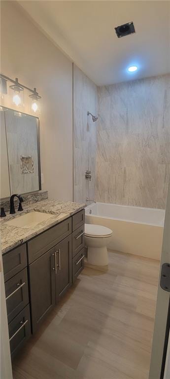 104 Lakeshore Dr, Kimberling City, MO 65686 - bathroom featuring vanity, wood finished floors, and bathtub / shower combination
