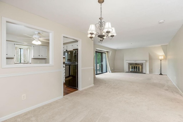 6720 W 109th St Unit F, Overland Park, KS 66211 - unfurnished living room with carpet floors, plenty of natural light, a chandelier, and a fireplace with flush hearth