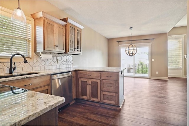 5214 NE 70th St, Kansas City, MO 64199 - kitchen with stainless steel dishwasher, a peninsula, tasteful backsplash, dark wood-style flooring, and glass insert cabinets