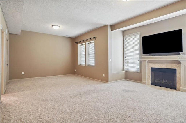 5214 NE 70th St, Kansas City, MO 64199 - unfurnished living room featuring carpet flooring, a textured ceiling, and a premium fireplace