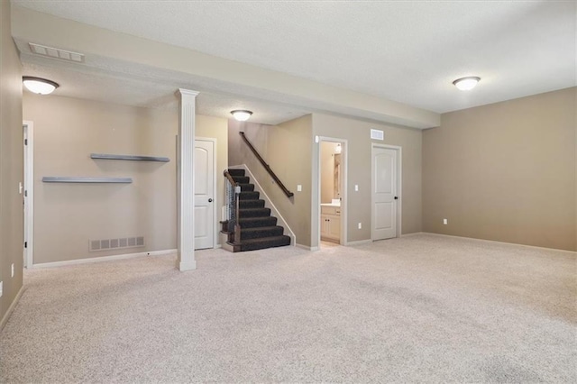 5214 NE 70th St, Kansas City, MO 64199 - basement featuring stairs, carpet floors, and a textured ceiling