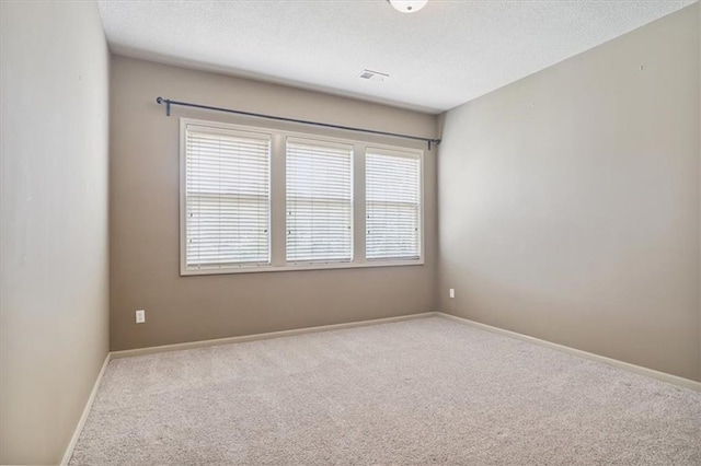 5214 NE 70th St, Kansas City, MO 64199 - unfurnished room featuring carpet floors and a textured ceiling