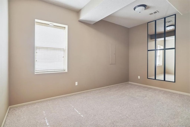 5214 NE 70th St, Kansas City, MO 64199 - empty room featuring carpet flooring and healthy amount of natural light