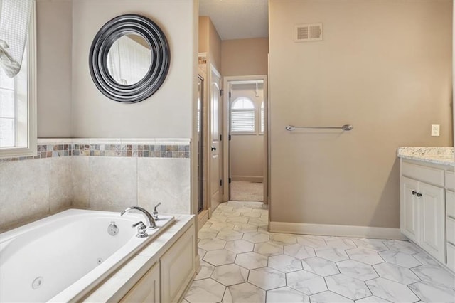 5214 NE 70th St, Kansas City, MO 64199 - bathroom featuring vanity and a whirlpool tub