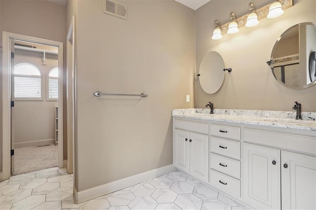 5214 NE 70th St, Kansas City, MO 64199 - bathroom featuring double vanity and tile patterned flooring