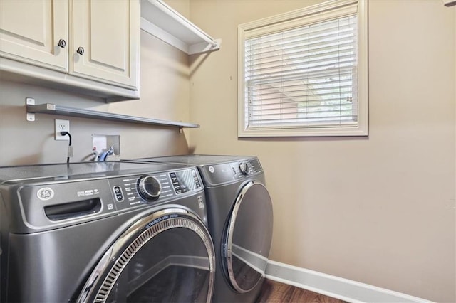5214 NE 70th St, Kansas City, MO 64199 - laundry room with cabinet space, washing machine and dryer, and dark wood-style flooring