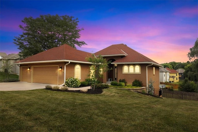 5214 NE 70th St, Kansas City, MO 64199 - ranch-style home featuring an attached garage, concrete driveway, and stucco siding