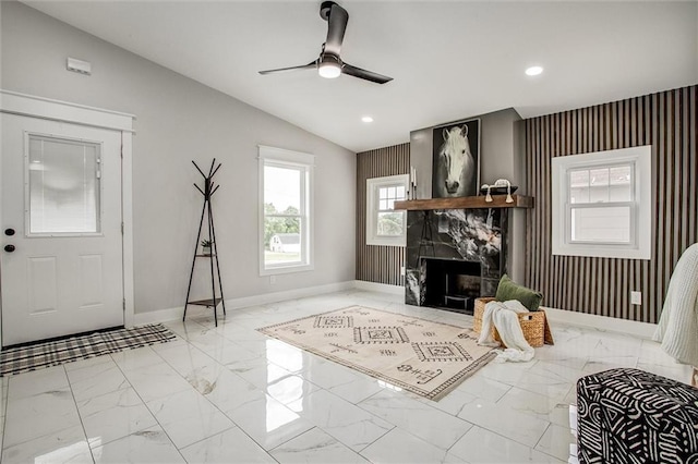 1975 Parallel Pkwy, Kansas City, KS 66104 - living area featuring marble finish floors, ceiling fan, a fireplace, recessed lighting, and lofted ceiling