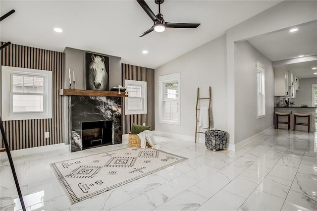 1975 Parallel Pkwy, Kansas City, KS 66104 - living area with marble finish flooring, a ceiling fan, a premium fireplace, recessed lighting, and plenty of natural light