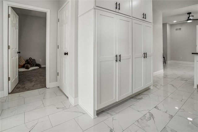 1975 Parallel Pkwy, Kansas City, KS 66104 - hallway with light marble finish floors and recessed lighting