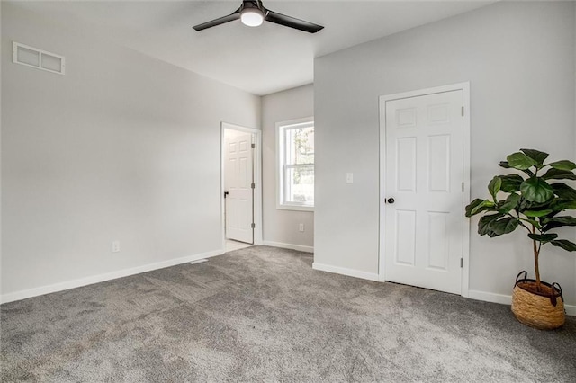 1975 Parallel Pkwy, Kansas City, KS 66104 - carpeted bedroom with baseboards and a ceiling fan