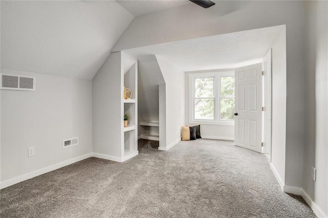 1975 Parallel Pkwy, Kansas City, KS 66104 - additional living space featuring carpet flooring, lofted ceiling, and ceiling fan