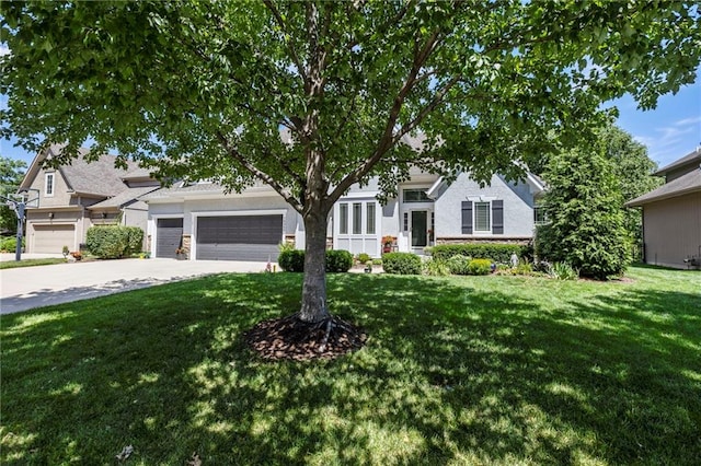 16369 S Woodstone Dr, Olathe, KS 66062 - obstructed view of property featuring driveway, a front lawn, a garage, and stone siding