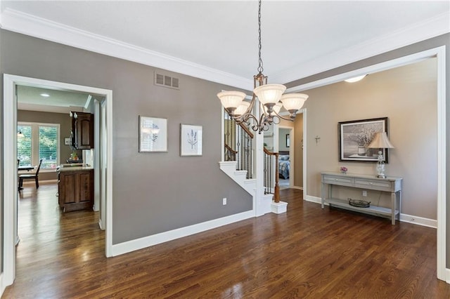 16369 S Woodstone Dr, Olathe, KS 66062 - unfurnished dining area with dark wood-style flooring, a chandelier, stairs, and ornamental molding